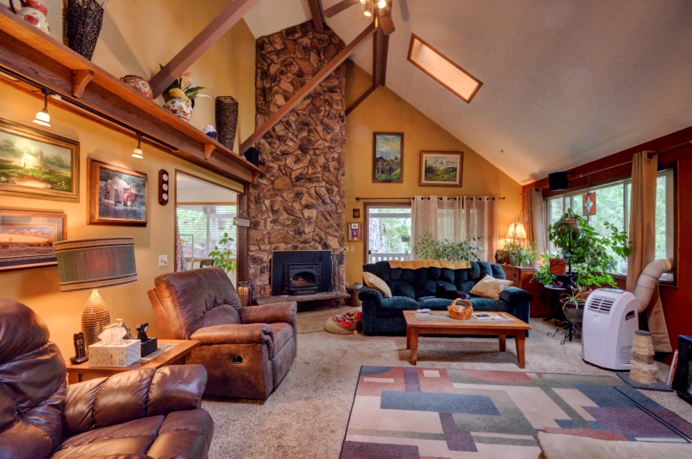 Four Bedroom Living Room with Stone Fireplace