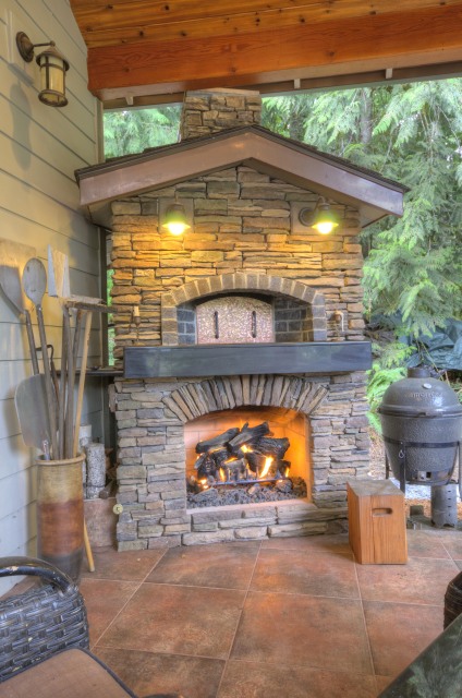 Outdoor Fireplace at this one level Craftsman Home at the Resort at the Mountain