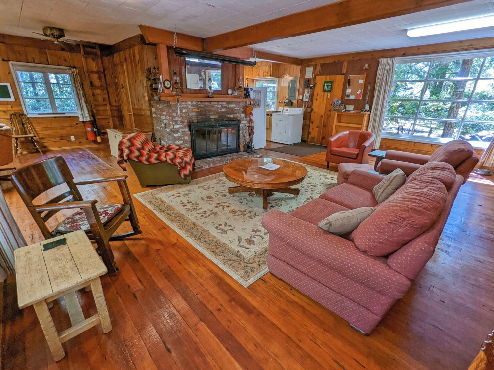 Zig Zag Riverfront Cabin Living room and fireplace