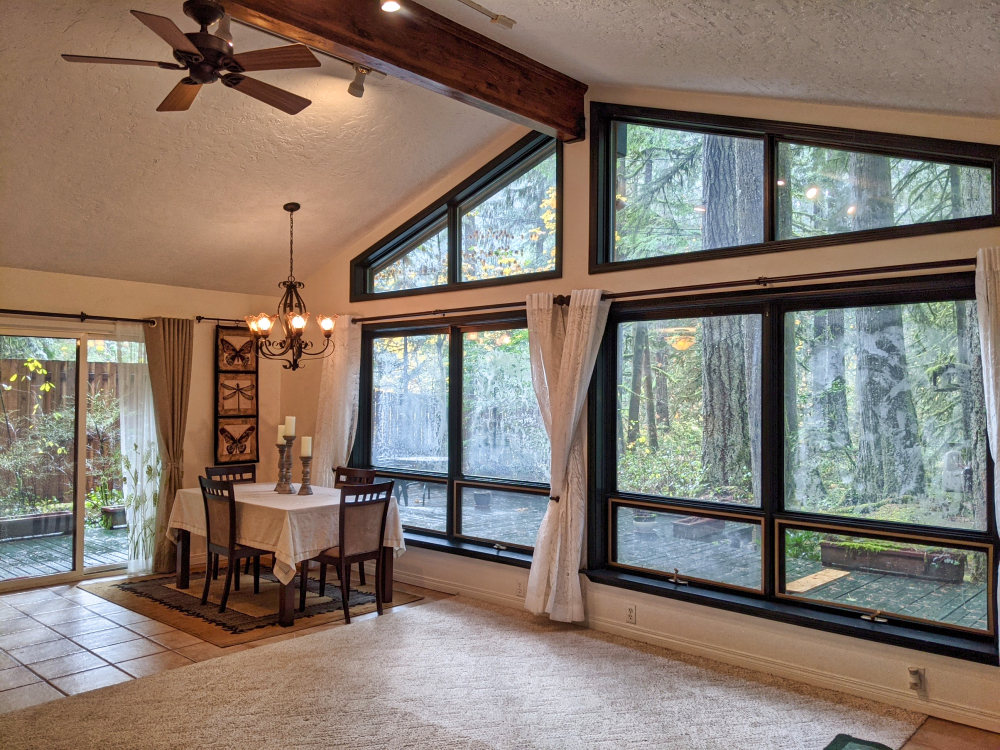 A wall of windows in this Rhododendron one level home